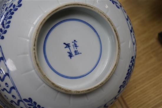 A 19th century Chinese blue and white punch bowl, Diameter 35cm. and three other bowls (a.f.)